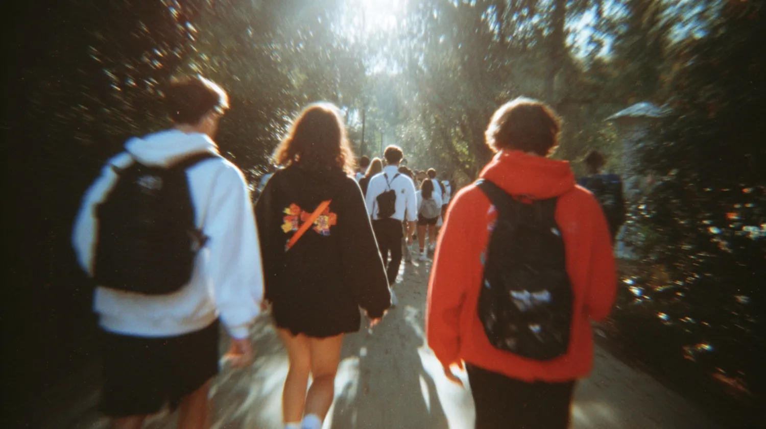 College students walking on campus with backpacks