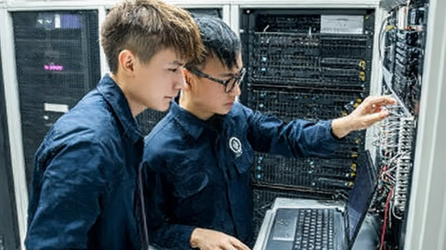 Vocational students training in a server room, representing modern technical education